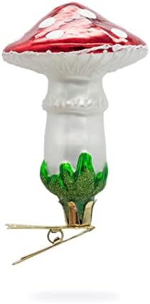 Cogumelos em um ornamento de vidro de alfinete